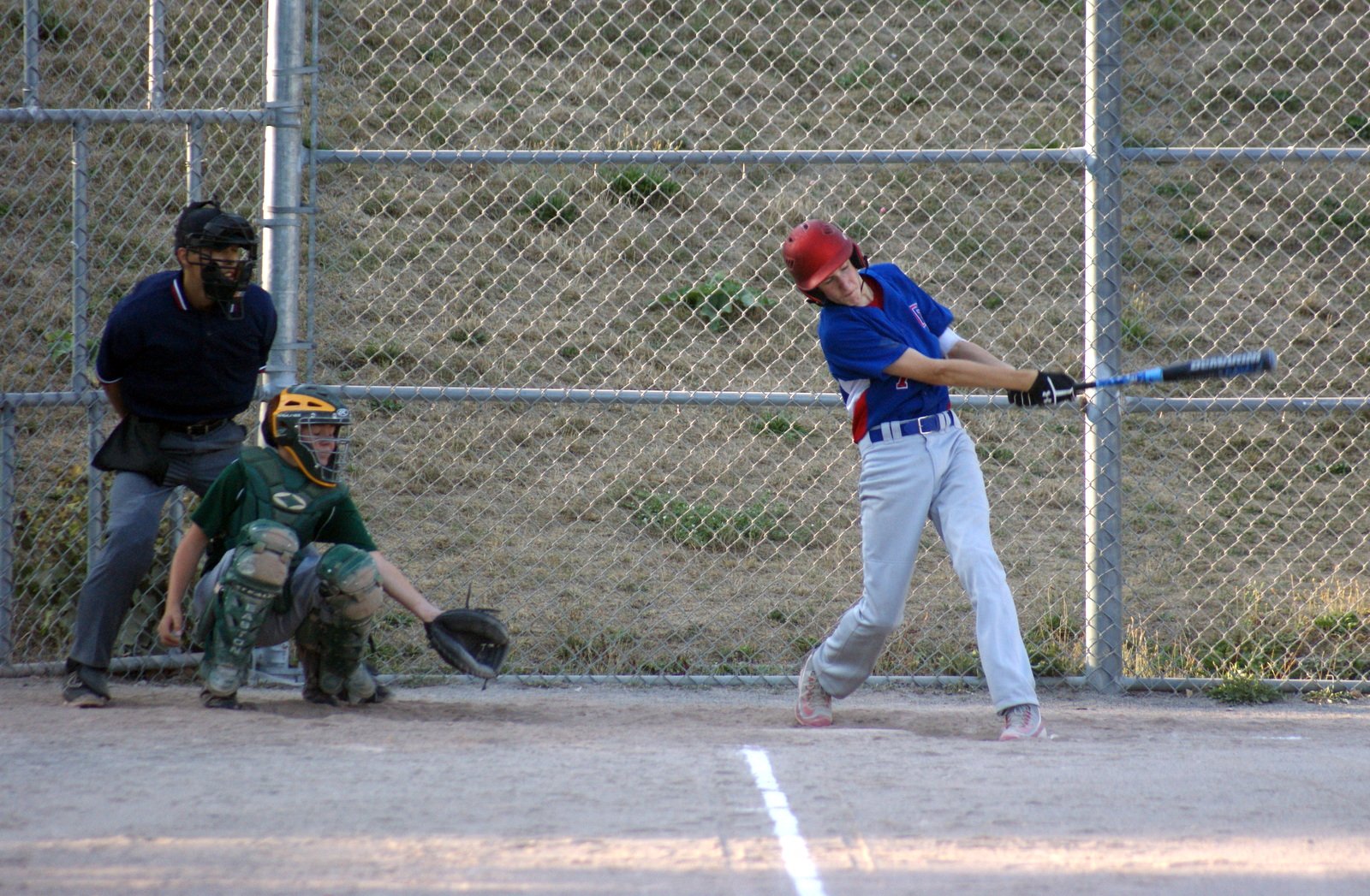 Alden (7) delivers a majestic two run home run shot over the left field fence in the first inning to give TP a 3-1 lead. In two at bats, Alden went 2 for 2 [home run and single] to power the TP offense with two runs scored and 3 RBI's.