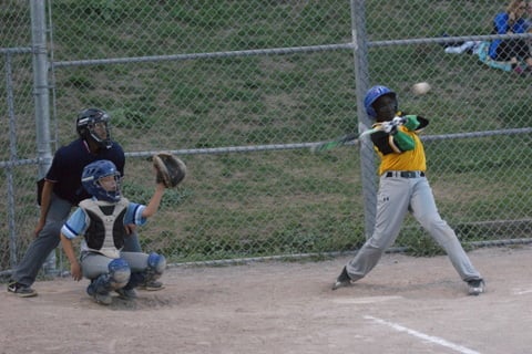 Dajuan (10) delivers a one out RBI sacrifice fly in the second inning to bring home the Pirates first run.